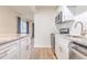 Modern kitchen with stainless steel appliances, ample cabinet space, and stylish countertops at 2412 53Rd S St, Gulfport, FL 33707