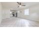 Spacious living room with tiled flooring, ceiling fan, and bright natural light at 2412 53Rd S St, Gulfport, FL 33707