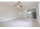 Open concept living room and kitchen featuring tiled flooring and stainless steel appliances at 2412 53Rd S St, Gulfport, FL 33707