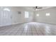 Living room boasting tile flooring, white walls, and a modern ceiling fan at 2412 53Rd S St, Gulfport, FL 33707