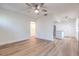 Open-concept living room featuring wood-look flooring, archways, and bright white paint at 2412 53Rd S St, Gulfport, FL 33707
