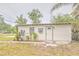 Exterior view of a detached outbuilding, complete with a separate entrance and landscaping at 2412 53Rd S St, Gulfport, FL 33707