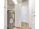 Utility room showcasing a water heater with easy access for maintenance and an extra door at 2412 53Rd S St, Gulfport, FL 33707