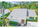 The aerial view showcases a home with well-maintained landscaping, including shrubs and a walkway to the entrance at 2507 Royal Pines Cir # 2H, Clearwater, FL 33763