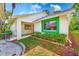 Beautiful villa with well-maintained landscaping and a cozy porch area, perfect for relaxation at 2507 Royal Pines Cir # 2H, Clearwater, FL 33763