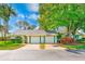 Charming single-story home featuring a two-car garage, lush landscaping, and a well-maintained yard at 2507 Royal Pines Cir # 2H, Clearwater, FL 33763