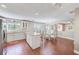 Well-lit eat-in kitchen featuring a kitchen island, stainless appliances, and tile flooring at 2507 Royal Pines Cir # 2H, Clearwater, FL 33763