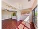 Inviting sunroom with wood-look floors, a ceiling fan, and access to a bright living space at 2507 Royal Pines Cir # 2H, Clearwater, FL 33763