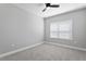 Bedroom featuring neutral walls, carpet flooring, and a window at 2612 Leafwing Ct, Palm Harbor, FL 34683