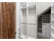 Walk-in closet with ample shelving and hanging space for organized storage at 2612 Leafwing Ct, Palm Harbor, FL 34683
