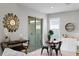 Bright dining area with a slider and a decorative mirror at 2612 Leafwing Ct, Palm Harbor, FL 34683