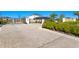 Gated entrance to the Silver Ridge community with brick paver drive and lush landscaping at 2612 Leafwing Ct, Palm Harbor, FL 34683