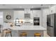 Well-lit kitchen with quartz countertops, stainless steel appliances, and ample cabinet space at 2612 Leafwing Ct, Palm Harbor, FL 34683