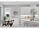 Cozy kitchen with a breakfast nook, quartz countertops, and modern appliances at 2612 Leafwing Ct, Palm Harbor, FL 34683
