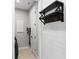 This is a functional laundry room with shelving and hooks at 2612 Leafwing Ct, Palm Harbor, FL 34683