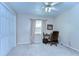 Bright and airy bedroom featuring a ceiling fan, window and a desk with office chair at 2749 Bent Leaf Dr, Valrico, FL 33594