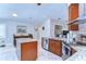 Well-lit kitchen with stainless steel appliances, granite countertops, and an island provides ample space for cooking at 2749 Bent Leaf Dr, Valrico, FL 33594