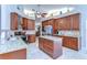 Spacious kitchen featuring granite countertops, stainless steel appliances, and a center island at 2749 Bent Leaf Dr, Valrico, FL 33594