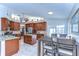 Spacious kitchen with stainless steel appliances, granite countertops, and a center island, open to dining area at 2749 Bent Leaf Dr, Valrico, FL 33594