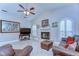 Inviting living room features vaulted ceilings, a fireplace, large windows, and comfortable seating for relaxation at 2749 Bent Leaf Dr, Valrico, FL 33594
