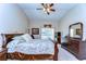 Spacious main bedroom includes a ceiling fan, carpeting, and a dresser, providing a comfortable retreat at 2749 Bent Leaf Dr, Valrico, FL 33594
