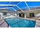 Backyard pool with a covered patio and an adjacent outdoor seating area at 2749 Bent Leaf Dr, Valrico, FL 33594