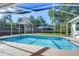 Refreshing screened-in pool with covered patio and clear view of the spacious backyard at 2749 Bent Leaf Dr, Valrico, FL 33594
