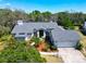 Desirable property featuring meticulous landscaping, a two-car garage, and elegant architectural details in a serene setting at 2910 Pine Club Dr, Plant City, FL 33566