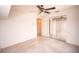 Bright bedroom with a ceiling fan, neutral carpet, and mirrored closet doors at 2910 Pine Club Dr, Plant City, FL 33566