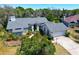 Charming single-story home with a manicured lawn, complemented by a two-car garage and a welcoming entrance at 2910 Pine Club Dr, Plant City, FL 33566