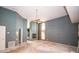 Spacious living room features a high ceiling, fireplace, and ample natural light from large windows at 2910 Pine Club Dr, Plant City, FL 33566