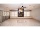 Open living room with vaulted ceiling, a fireplace, and large windows offering plenty of natural light at 2910 Pine Club Dr, Plant City, FL 33566
