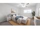 Bright bedroom with neutral walls, ceiling fan, and large window for natural light at 3147 Mission Grove Dr # 3147, Palm Harbor, FL 34684