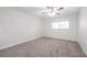 Empty bedroom showcasing neutral walls and carpet, ready for personalization at 3147 Mission Grove Dr # 3147, Palm Harbor, FL 34684