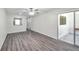 Open-concept living room with hardwood floors, plenty of natural light, and access to outdoor space at 3147 Mission Grove Dr # 3147, Palm Harbor, FL 34684