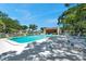 Inviting community pool area with ample seating and shaded spots for relaxation at 3147 Mission Grove Dr # 3147, Palm Harbor, FL 34684