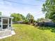 Expansive backyard featuring lush green grass and landscaping at 3210 Acacia St, Lutz, FL 33558