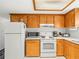 Efficient kitchen layout with modern appliances and functional counter space at 3210 Acacia St, Lutz, FL 33558