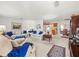 Open-concept living room leading into the kitchen and dining area at 3210 Acacia St, Lutz, FL 33558