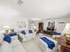 Inviting living room with plush sofas, carpeted floors, and ample natural light at 3210 Acacia St, Lutz, FL 33558