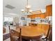 Open concept living space integrates dining, kitchen, and living areas for a seamless flow at 3210 Acacia St, Lutz, FL 33558