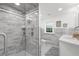 Beautiful bathroom featuring a luxurious marble shower, and white marble countertops and cabinets at 346 16Th Ne Ave, St Petersburg, FL 33704