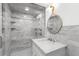 Bathroom featuring a glass shower with marble walls, marble vanity, and modern fixtures at 346 16Th Ne Ave, St Petersburg, FL 33704