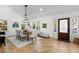 Bright dining room with hardwood floors, large windows, and a stylish chandelier at 346 16Th Ne Ave, St Petersburg, FL 33704