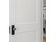 Stylish glass doorknob and black hardware on a white paneled door at 346 16Th Ne Ave, St Petersburg, FL 33704