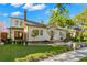Charming two-story home with a manicured lawn, lush landscaping, and inviting front entrance at 346 16Th Ne Ave, St Petersburg, FL 33704