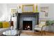 Living room fireplace with gray tile surround, herringbone floor, and hearth at 346 16Th Ne Ave, St Petersburg, FL 33704