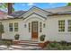 A beautifully appointed home entrance with a stained wood door and inviting brick-lined steps at 346 16Th Ne Ave, St Petersburg, FL 33704