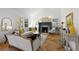 Bright living room with a fireplace, hardwood floors, and comfortable seating area at 346 16Th Ne Ave, St Petersburg, FL 33704