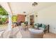 Covered patio features a brick fireplace, seating area, and stylish decor at 346 16Th Ne Ave, St Petersburg, FL 33704